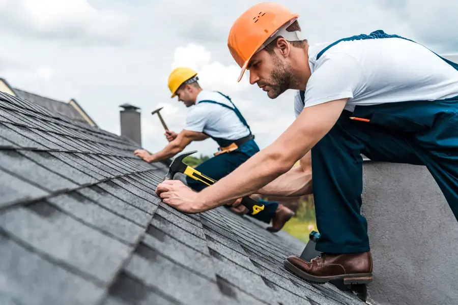 Professional contractor repairing a residential roof